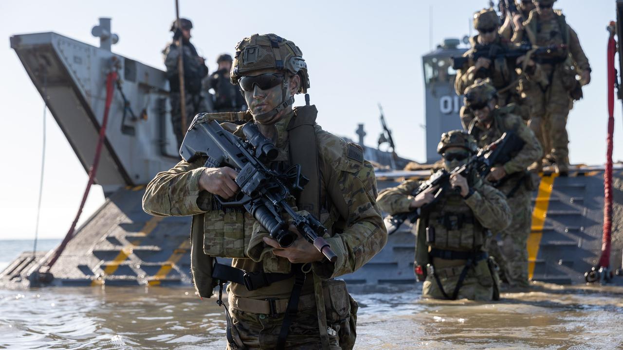 Personnel from the 3rd Battalion Royal Australian Regiment, conduct a practice beach assault on Forrest Beach, Queensland, during Exercise Talisman Sabre 21.