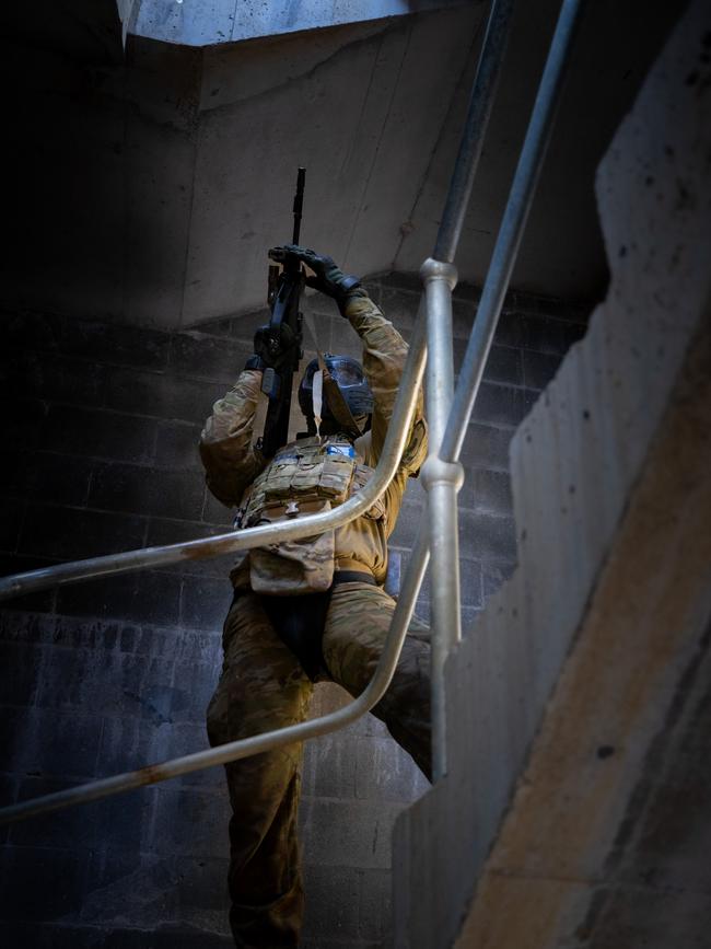 An Australian army soldier from the 3rd Battalion, Royal Australian Regiment, provides security on a stairway during the conduct of an urban assault serial using the Blue Bolt non-lethal training ammunition, as part of the 2022 Duke of Gloucester Cup in Singleton. *** Local Caption *** Australian Army infantry soldiers from across Australia tested their core skills for the prestigious Duke of Gloucester Cup at the School of Infantry, near Singleton in NSW, July 31 - August 5 2022. The Duke of Gloucester Cup is the Armyâ€™s premier military skills competition, pitting the best Royal Australian Corps of Infantry rifle sections from each unit against one another through a series of challenging activities that test their core infantry skills, including marksmanship, tactics, teamwork and fitness. Along with the Duke of Gloucester Cup, five other trophies are awarded: Sir Arthur MacDonald Trophy for best foundation war-fighting skills; Gurkha Trophy for best live-fire shooting; Royal Ulster Rifles Trophy for best falling plate shooting; OSCMAR Trophy for best battle endurance; and the DSM Roche CSC Memorial Cup for best individual soldier. The Duke of Gloucester Cup was created by Prince Henry, Duke of Gloucester, in 1946, while serving as the Governor-General of Australia.