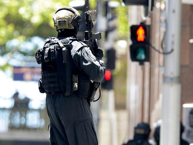 Police attend a siege in the Lindt shop in Sydney's Martin Place. Photos: Chris McKeen