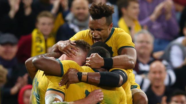 BRISBANE, AUSTRALIA - JULY 27: Reece Hodge of the Wallabies celebrates with teammates after scoring a try during the 2019 Rugby Championship Test Match between Australia and Argentina at Suncorp Stadium on July 27, 2019 in Brisbane, Australia. (Photo by Jason McCawley/Getty Images)