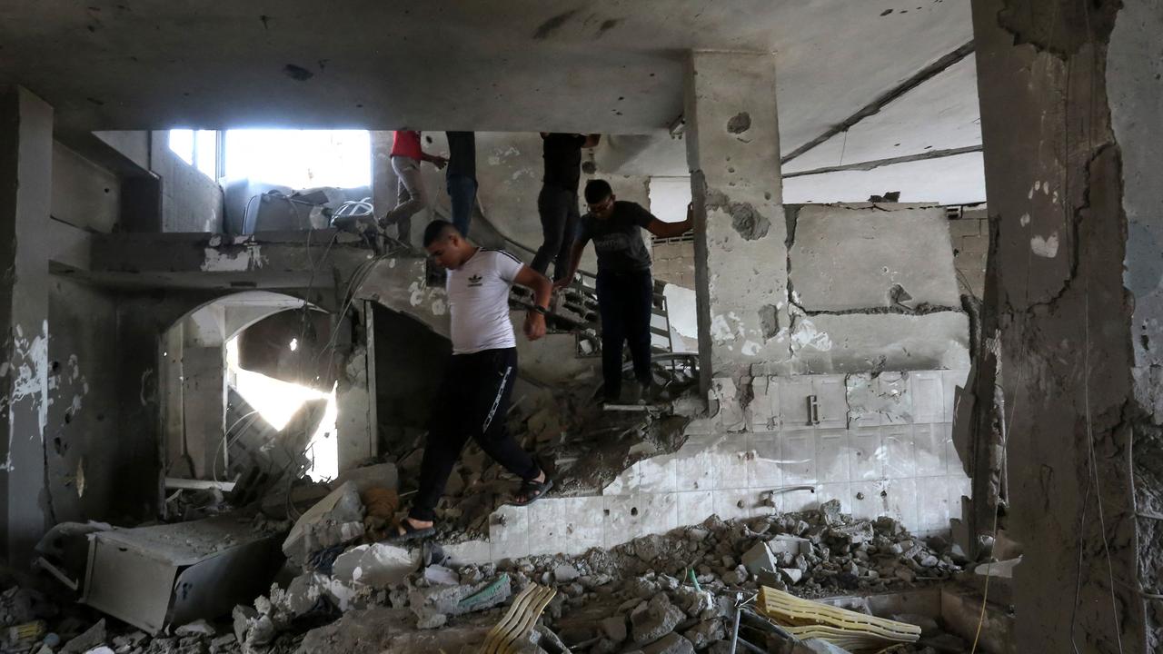 People check the damage inside a building in the occupied West Bank city of Jenin, following an Israeli air strike on October 22, 2023. Picture: AFP
