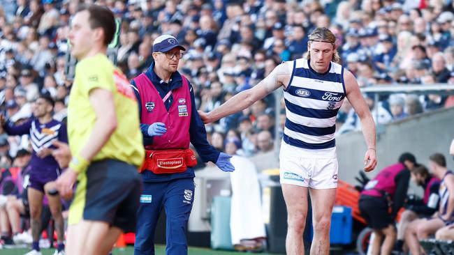 Mark Blicavs limps to the boundary. Picture: Michael Willson/AFL Photos via Getty Images.