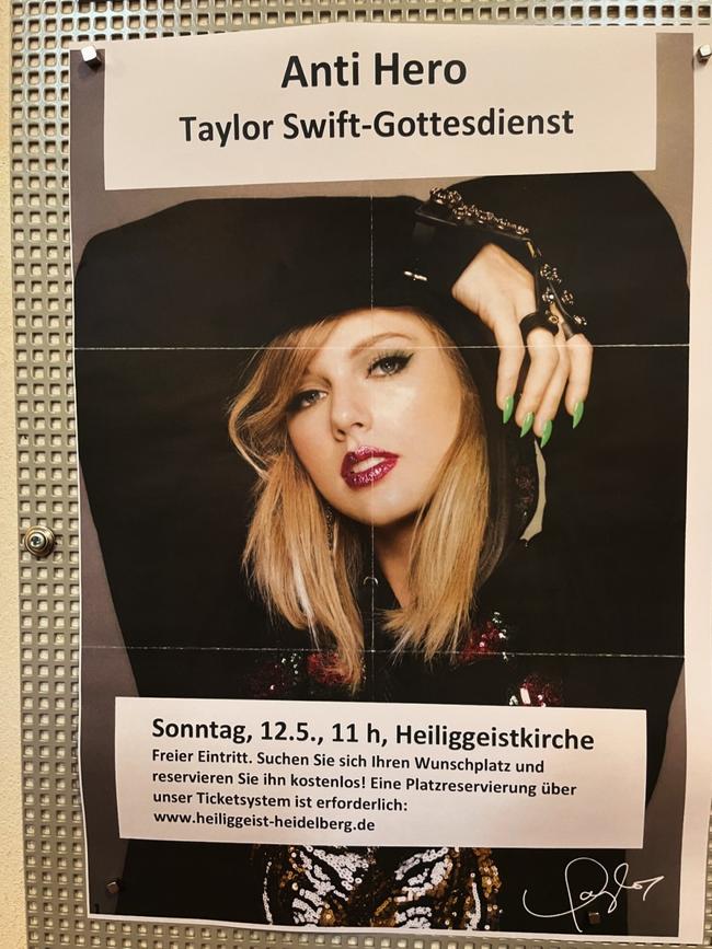 A Taylor Swift poster on the wall of the church.