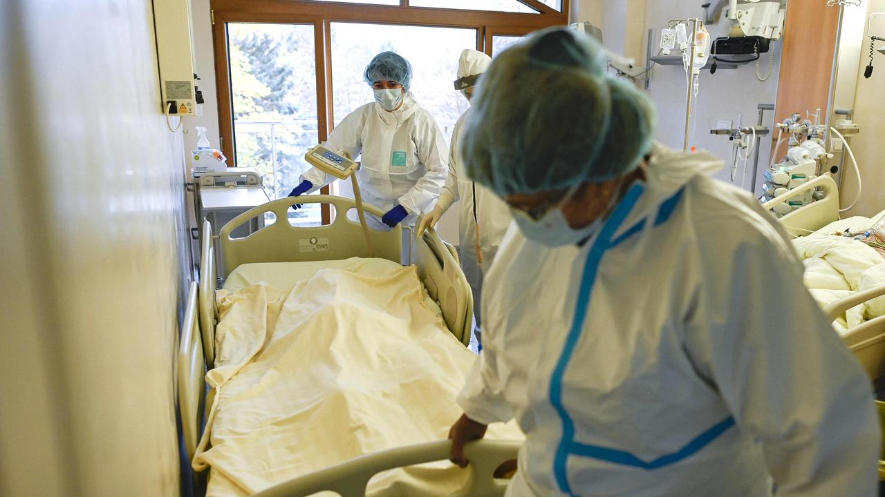 A medical staff member pushes a trolley bed carrying the body of a deceased Covid-19 coronavirus patient in the intensive care unit of Lozenets Hospital in Sofia.