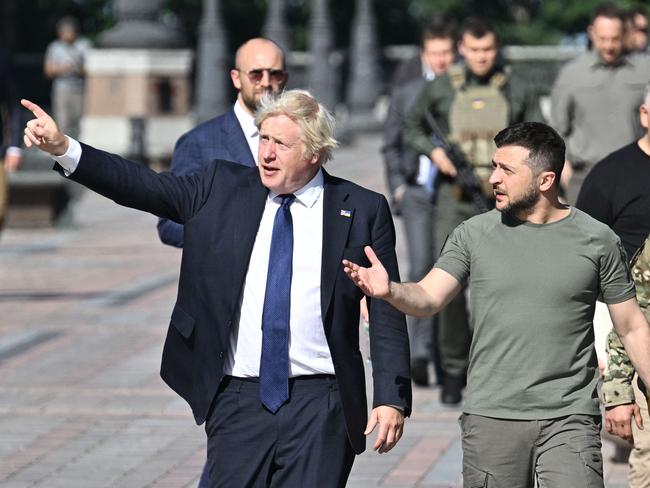 Ukrainian President Volodymyr Zelenskyy and former British Prime Minister Boris Johnson walk at the Ally of Bravery on Ukraine's Independence Day. Picture: AFP