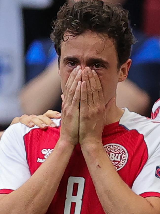 Denmark midfielder Thomas Delaney reacts as Christian Eriksen is attended to by medics. Picture: AFP