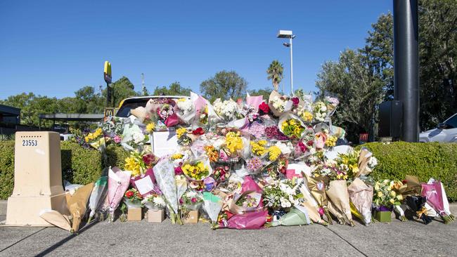 Wreaths of condolence are laid outside McDonald’s restaurant in Queen St, Campbelltown where Paramedic Steven Tougher was killed in the early hours of Friday April 14. Picture: NCA NewsWire/Simon Bullard.