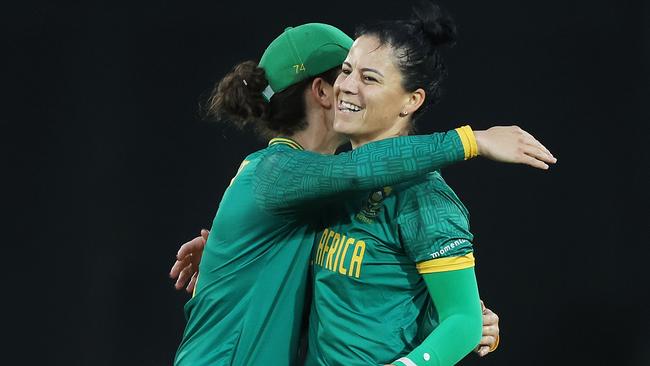 South Africa’s Marizanne Kapp of South Africa celebrates with Laura Wolvaardt after taking the wicket of Beth Mooney. Picture: Mark Metcalfe/Getty Images