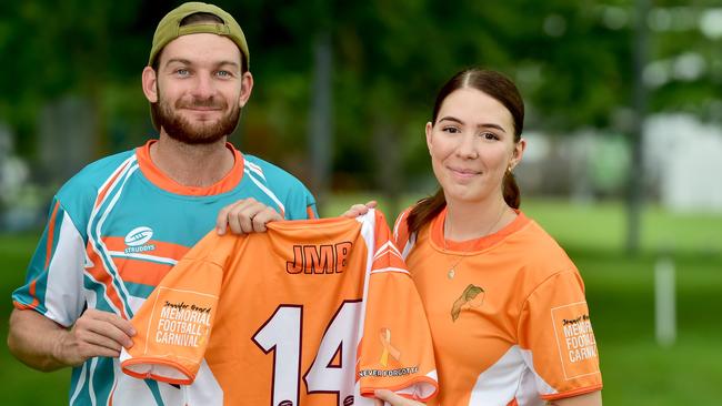 Luke Southgate and Jennifer Board's sister, Siana, with Jennifer's jersey with her favourite number at Victoria Park in South Townsville. Picture: Evan Morgan