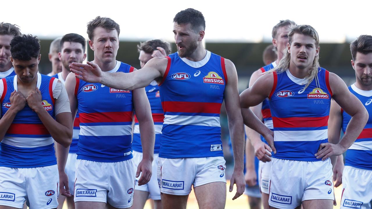 The Bulldogs look dejected after a loss to Hawthorn. Picture: Michael Willson/AFL Photos via Getty Images