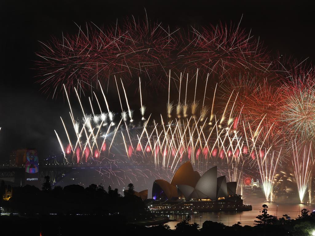 New Year's Eve 2018 - The midnight fireworks display over the Sydney Opera House and Sydney Harbour Bridge from a rooftop in Potts Point. Picture: Toby Zerna