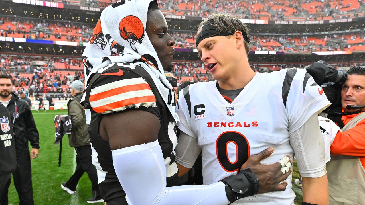 Joe Burrow and Myles Garrett meet on the field. (Photo by Jason Miller/Getty Images)