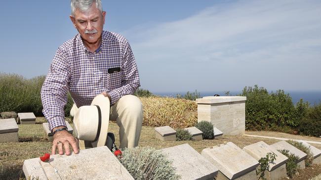 Remembering them ... Centenary of the August 1915 at Lone Pine. Doug Baird father of Cameron Baird VC, follows in his late son's footsteps by visiting the headstone of Trooper Harold Rush. Picture: David Caird.