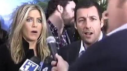 Jennifer Aniston could not contain her shock when Brad Blanks stood up. Picture: YouTube