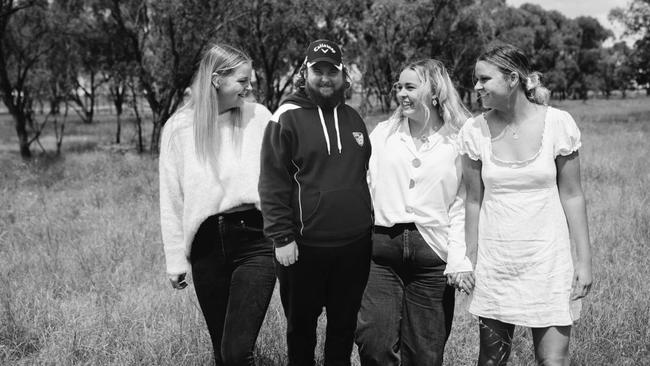 Braedyn Gordon (middle) surrounded by his loved ones. Picture: Supplied