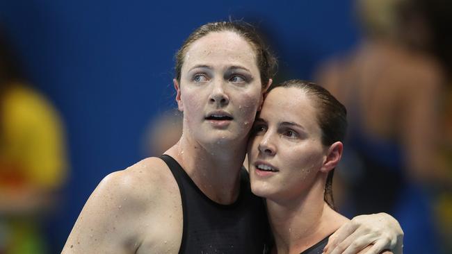 Australia’s Cate Campbell with sister Bronte after finishing sixth and fourth in the women’s 100m final. Picture: Brett Costello