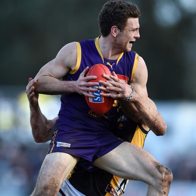 Johnson tangles with Balwyn’s Danny Hughes during the 2016 grand final. The Eagles meet Balwyn in a 1 v. 2 clash this weekend. Picture: Steve Tanner