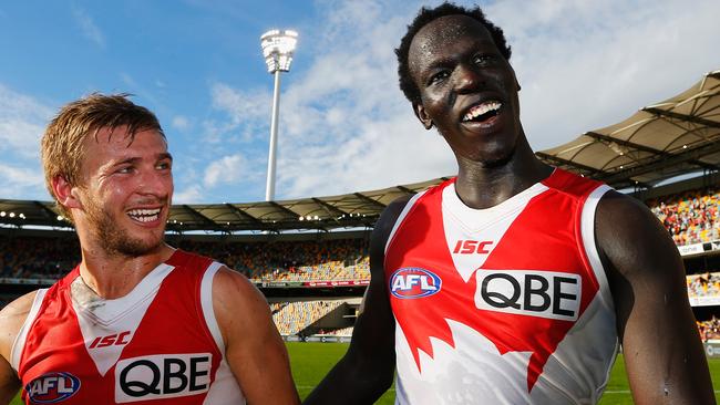 Kieren Jack and Aliir Aliir celebrate Sydney’s win against Brisbane.