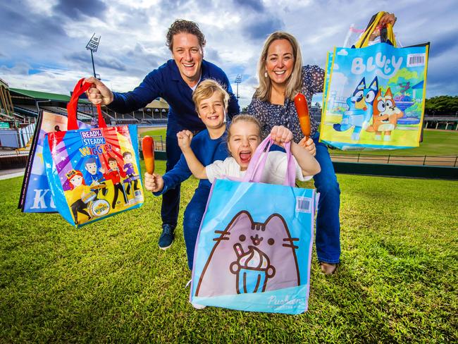 Scott and Alex Daly from Clayfield with their kids Hugo, 10, and Matilda, 7, with showbags and dagwood dogs ahead of the Ekka. Picture: Nigel Hallett