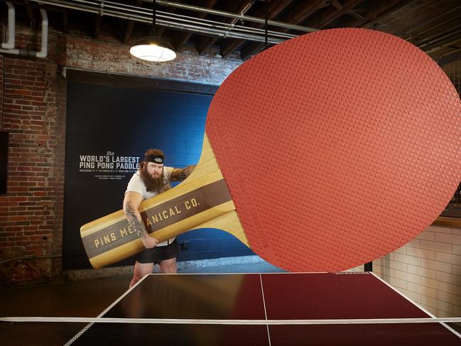 The world’s largest table tennis bat. Picture: Kevin Scott Ramos/Guinness World Records