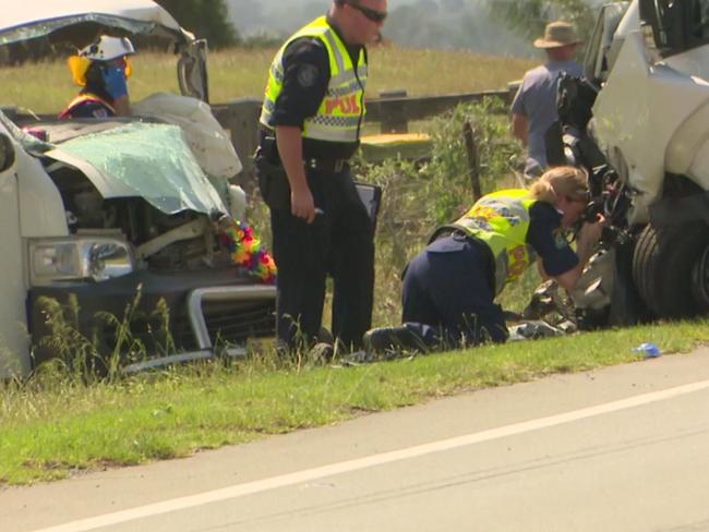 Crash investigators look over one of the vehicles. Picture: TVN