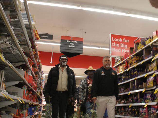Robin Granites, the grandfather of a 24-year-old man from Yuendumu walks through aisle four in Coles Alice Springs during a vigil for the young man. The young man died in custody inside the supermarket on May 27, 2025, in aisle four, the lolly aisle. Picture: Gera Kazkov
