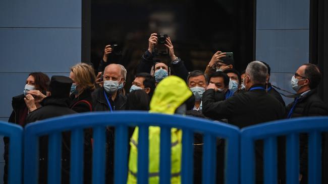 The WHO team visit the closed Huanan Seafood wholesale market in Wuhan, in China's central Hubei province on Sunday. Picture: AFP