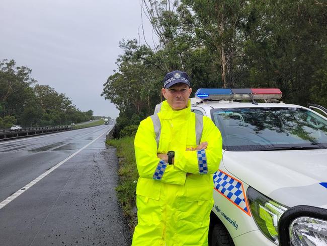 Sunshine Coast police officer Senior Sergeant Scott Wiggins at the Bruce Highway checkpoint to prevent Brisbane residents from reaching the region.