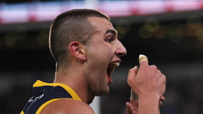 ADELAIDE, AUSTRALIA - AUG 17: Josh Rachele of the Crows gestures to the crowd after scoring a goal during the 2024 AFL Round 23 match between the port Adelaide Power and the Adelaide Crows at Adelaide Oval on August 17, 2024 in Adelaide, Australia. (Photo by James Elsby/AFL Photos via Getty Images)