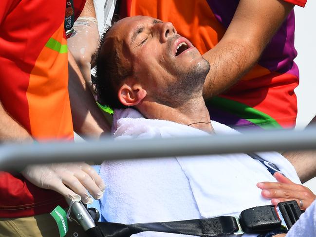 France's Yohann Diniz is helped by officials after competing in the Men's 50km Race Walk at the Rio 2016 Olympic Games. Picture: AFP/Jewel Samad