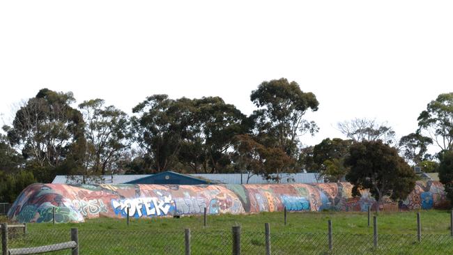 The now derelict Giant Worm on Bass Highway has been used by squatters, drug users and rough sleepers, neighbours say.