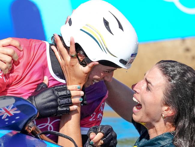 Australia's Noemie Fox (centre) celebrates winning gold in the Women's Kayak Cross Final at the Vaires-sur-Marne Nautical Stadium on the tenth day of the 2024 Paris Olympic Games in France. Picture date: Monday August 5, 2024. (Photo by John Walton/PA Images via Getty Images)