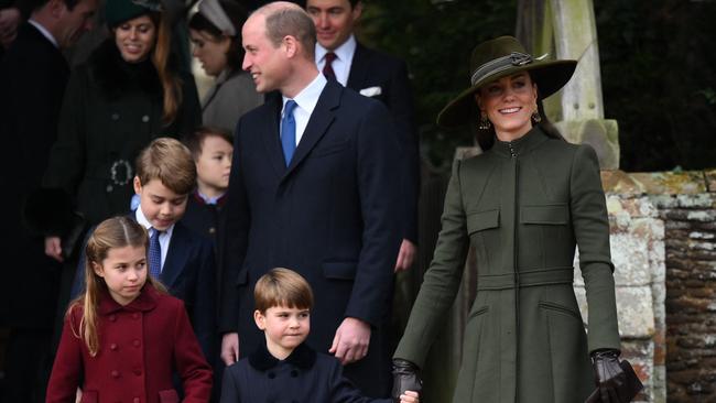 Prince William and Princess Catherine with their children Charlotte, George and Louis leave at the end of the Royal Family's traditional Christmas Day service at St Mary Magdalene Church in Sandringham, Norfolk, eastern England, on December 25, 2022. (Photo by Daniel LEAL / AFP)