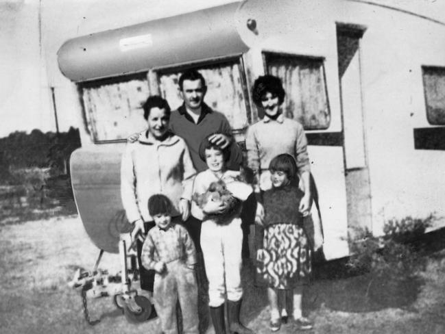 The Beaumont family with an unidentified woman by a caravan some time before the children’s 1966 disappearance from Glenelg beach.