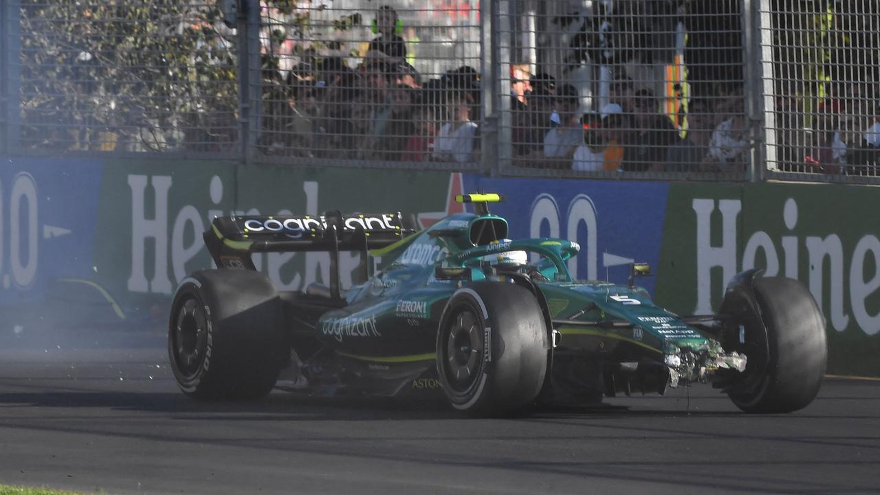 Aston Martin's German driver Sebastian Vettel attempts to drive on after a crash