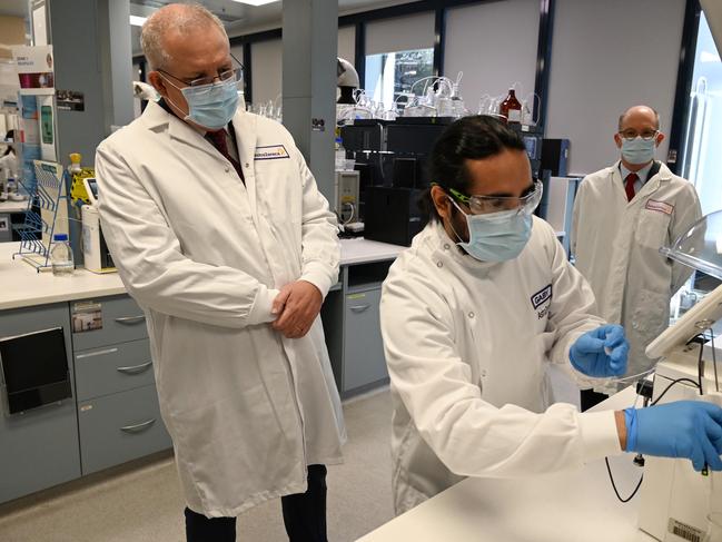 SYDNEY, AUSTRALIA - AUGUST 19: Prime Minister Scott Morrison takes a tour at the AstraZeneca laboratories in Macquarie Park, on August 19, 2020 in Sydney, Australia. The Australian government has announced an agreement with the British pharmaceutical giant AstraZeneca to secure at least 25 million doses of a COVID-19 vaccine if it passes clinical trials.  The University of Oxford COVID-19 vaccine is currently in phase-three testing. If the vaccine proves to be successful, Australia will manufacture and supply vaccines and will be made available for free. The project could deliver the first vaccines by the end of this year or by early 2021. (Photo by Nick Moir - Pool/Getty Images)