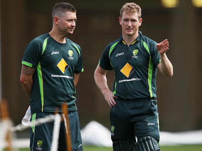 Michael Clarke and George Bailey hold a pow wow during a training session.