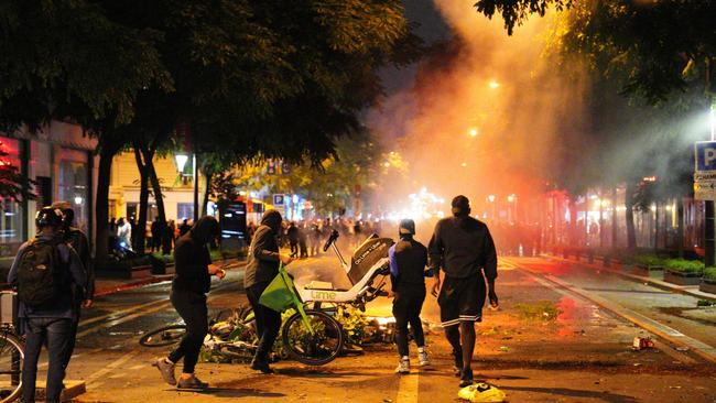 Demonstrators burnt e-bikes during the protest. Picture: Carl Court/Getty