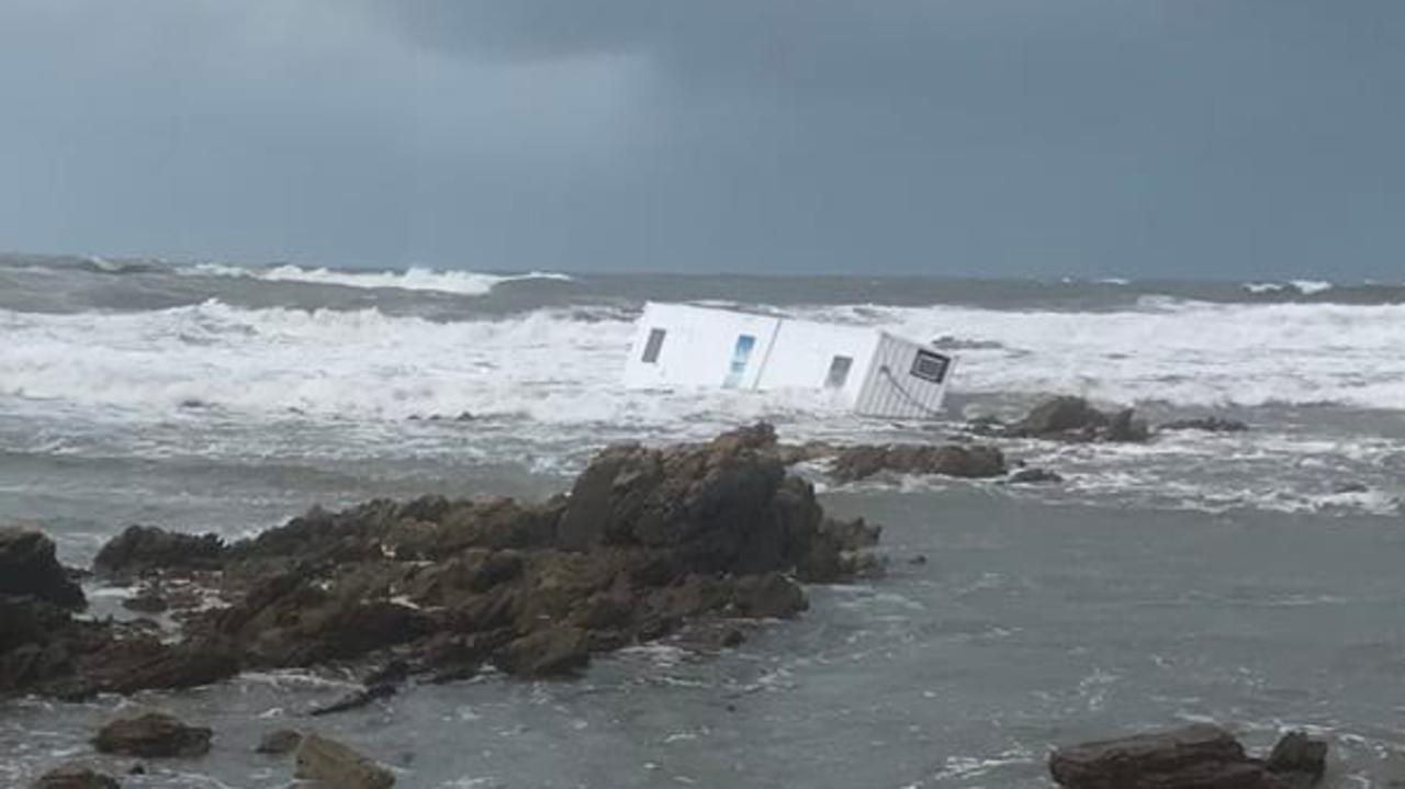 A container was washed off a rig near Burnie on Sunday due to the strong winter winds moving through Tasmania. Picture: Tasmania Police