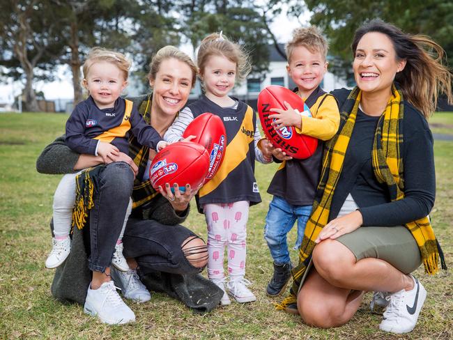 Trent Cotchin's wife, Brooke, and kids, Mackenzie, 1, and Harper, 3, with Shaun Grigg’s wife, Sarah and  Sonny, 3. Picture: Mark Stewart