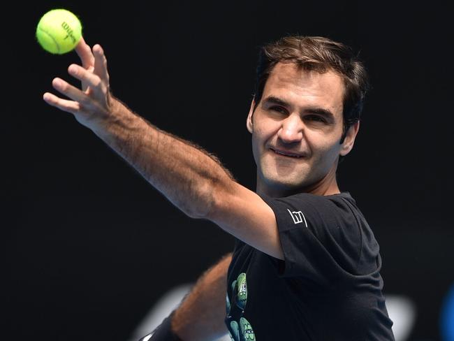 Federer practices his serving at Melbourne Park. Picture: AFP