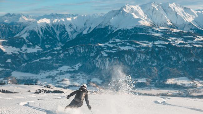 Skiing fresh powder in Laax, Switzerland.