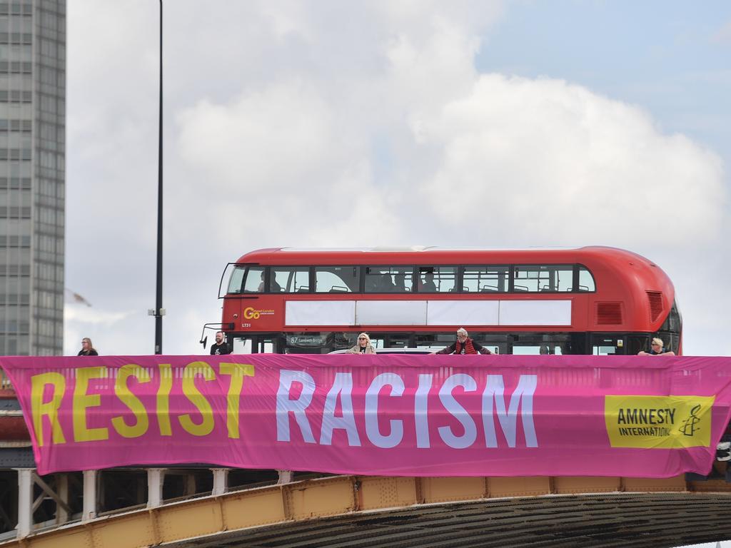 Five Amnesty International banners opposite the US Embassy have a “resist racism” message. Daniel LEAL-OLIVAS / AFP. <a capiid="a54c57d1e2a9b851f34a6e28687f34ef" class="capi-video">Sky News host Nicholas Reece says it is 'dangerous' for United States President Donald Trump to weigh in on politics on the United Kingdom in 'the crazy way' he has been.</a>