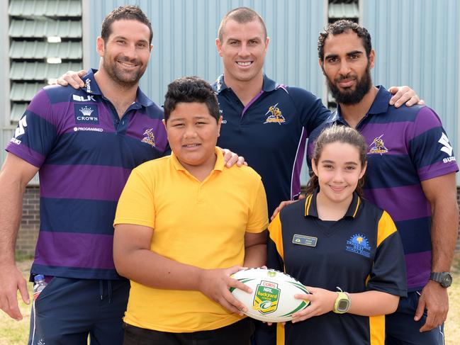 NRL Bryan Norrie, Dayne Weston and Travis Robinson players visit students Robert, 11, and Emilia, 11, at Cranbourne West Primary School to deliver a no-bullying message through sport.