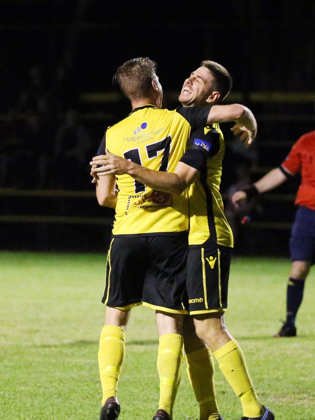 Tigers' Josh Taylor hugs his team mate Aaron Bull after he scored a goal off a header in the FNQ Football Premiership match between the Edge Hill Tigers and the Marlin Coast Rangers, held at Tiger Park, Manunda. Picture: Brendan Radke