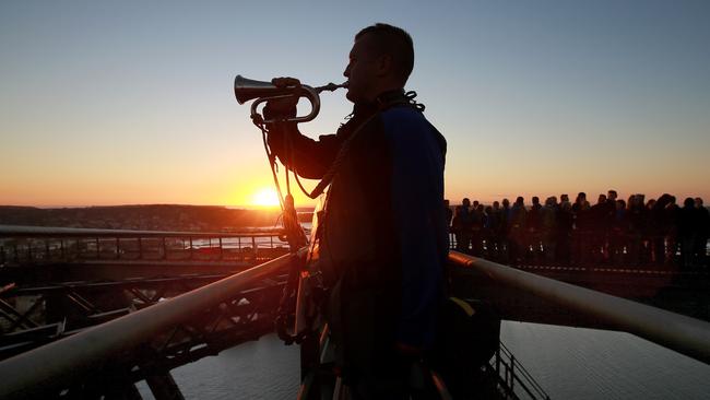 Marcus Salone plays The Last Post on the Harbour Bridge. Picture: Toby Zerna