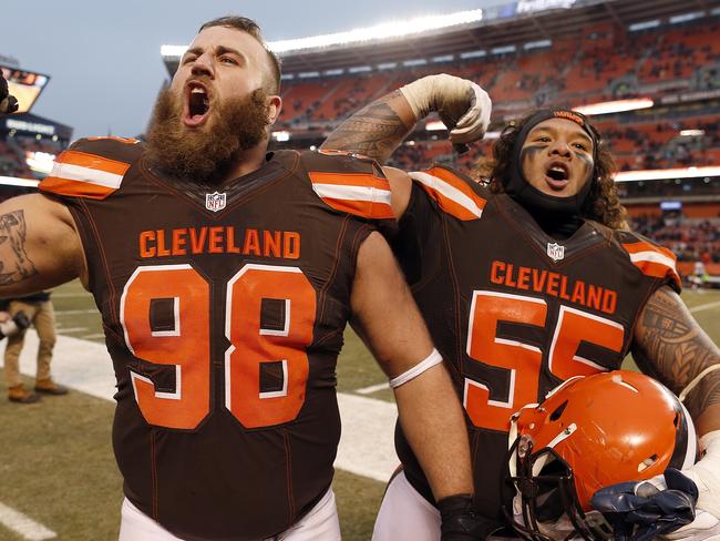 CLEVELAND, OH - DECEMBER 24: Jamie Meder #98 and Danny Shelton #55 of the Cleveland Browns celebrate after defeating the San Diego Chargers 20-17 at FirstEnergy Stadium on December 24, 2016 in Cleveland, Ohio. Wesley Hitt/Getty Images/AFP == FOR NEWSPAPERS, INTERNET, TELCOS & TELEVISION USE ONLY ==