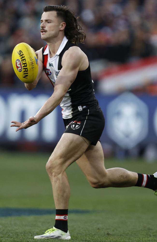 St Kilda star Jack Sinclair fires a handball.