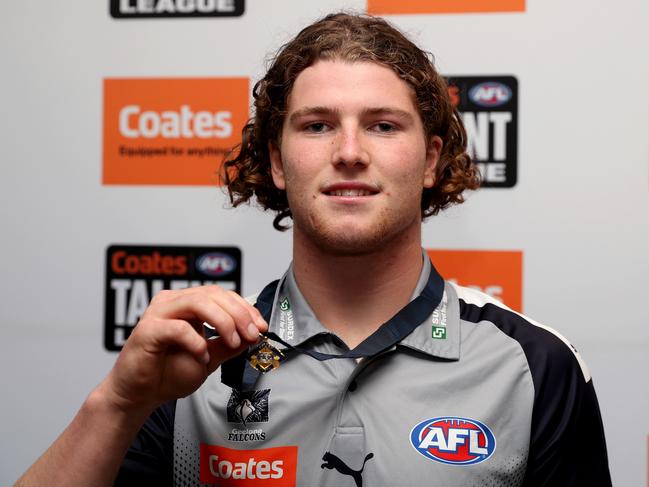 MELBOURNE, AUSTRALIA - SEPTEMBER 24:  Patrick Hughes of the Geelong Falcons poses for a portrait with the Best and Fairest 2023 Morrish Medal, joint winner during the Coates Talent League Boys Grand Final match between Sandringham Dragons  and Eastern Ranges at Ikon Park on September 24, 2023 in Melbourne, Australia. (Photo by Kelly Defina/AFL Photos/via Getty Images)