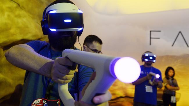 Gamers try out the new Sony VR headset in Sony PlayStation booth during the annual E3 2016 gaming conference at the Los Angeles Convention Center. Picture: Kevork Djansezian/Getty Images